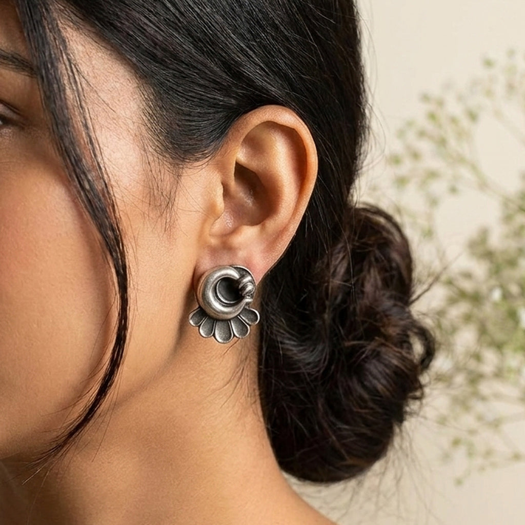Silver Blossom Petite Studs worn on the ear, handmade by Dream Karigiri