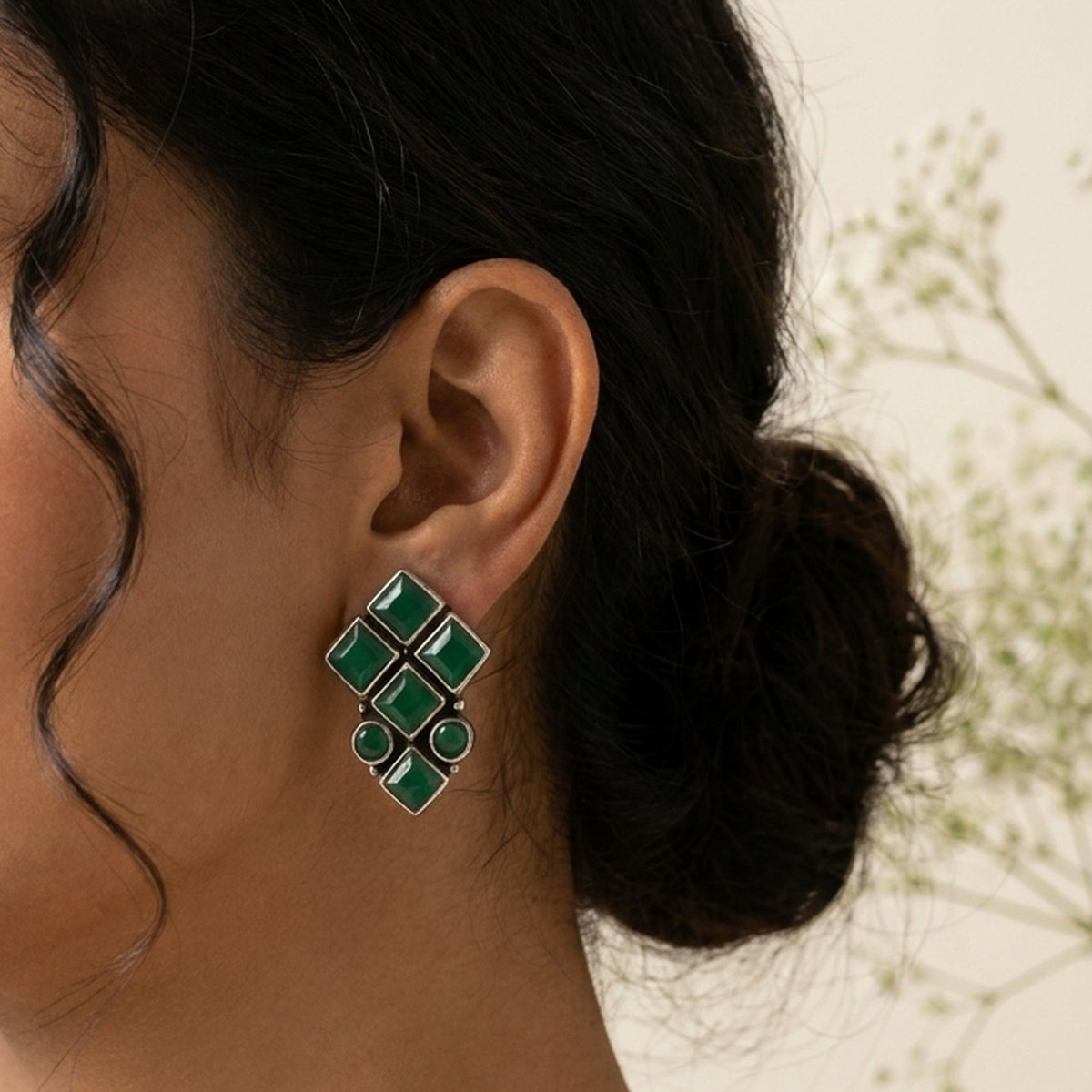 Emerald Green Kundan Square Studs worn on the ear, handmade by Dream Karigiri