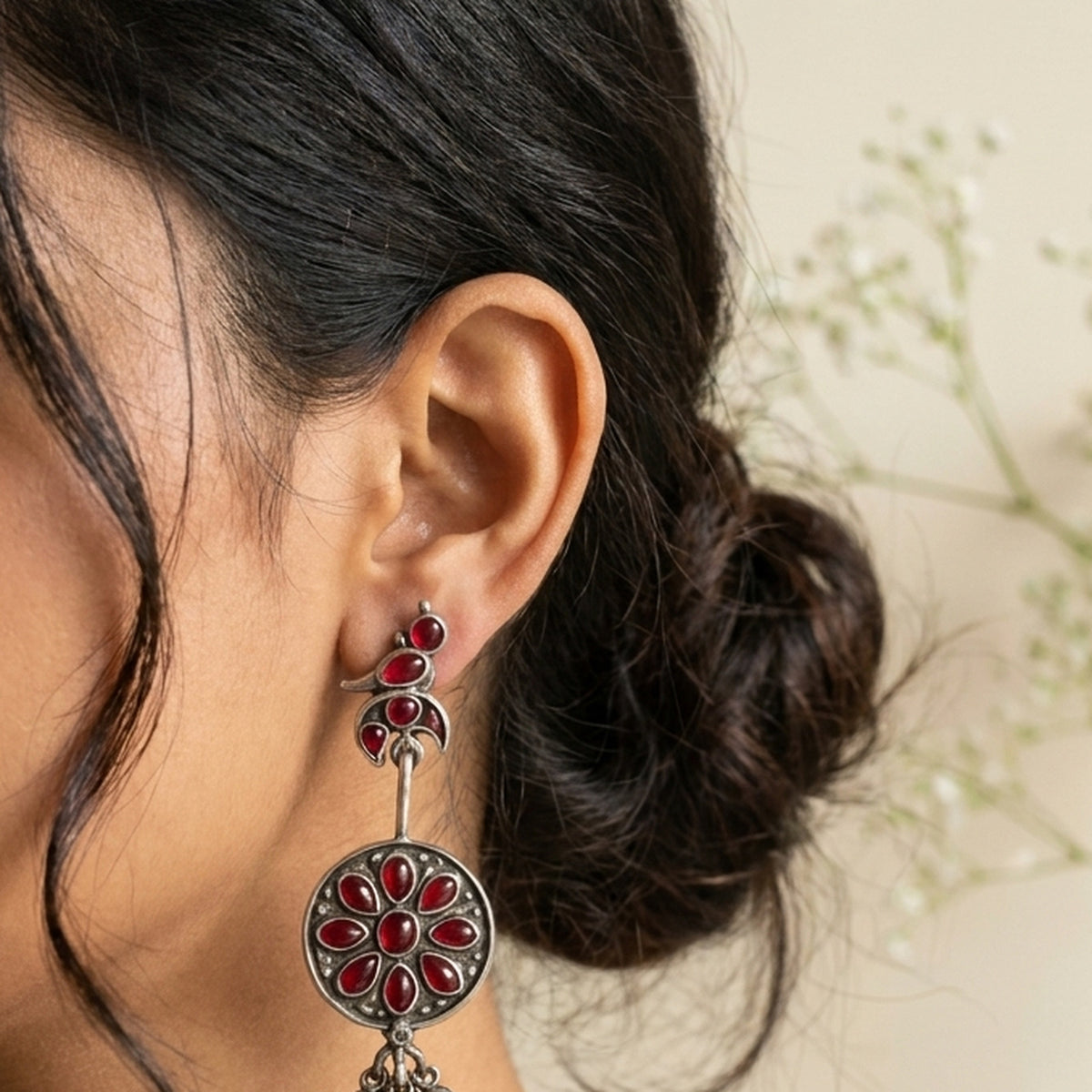 Red Lotus Coin Drop Earrings worn on the ear, handmade by Dream Karigiri