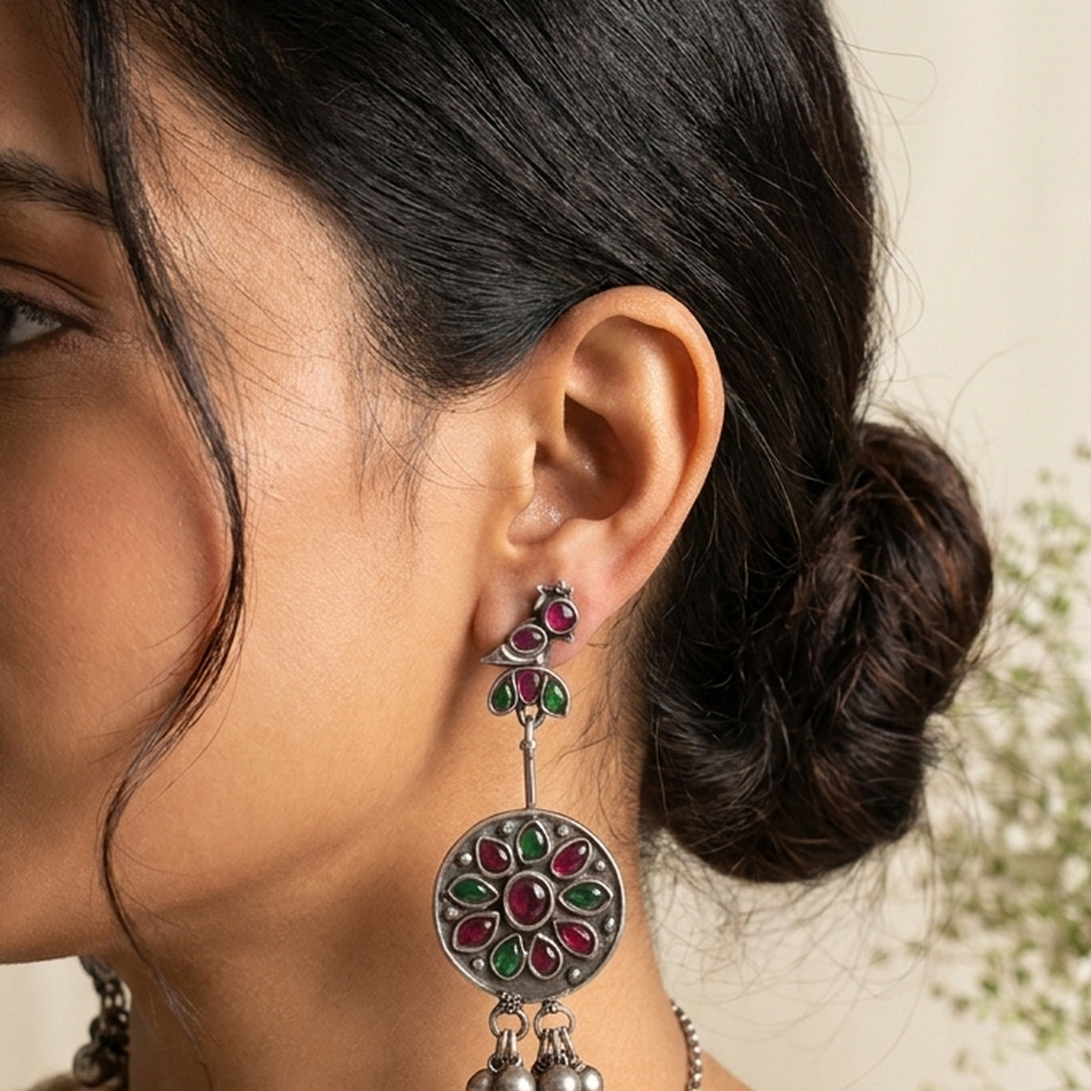 Red & Green Petal Coin Drops worn on the ear, handmade by Dream Karigiri