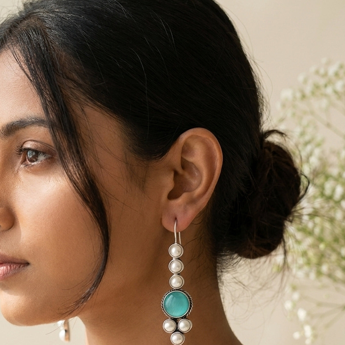 Ocean Blue Stone & Pearl Drops worn on the ear, handmade by Dream Karigiri