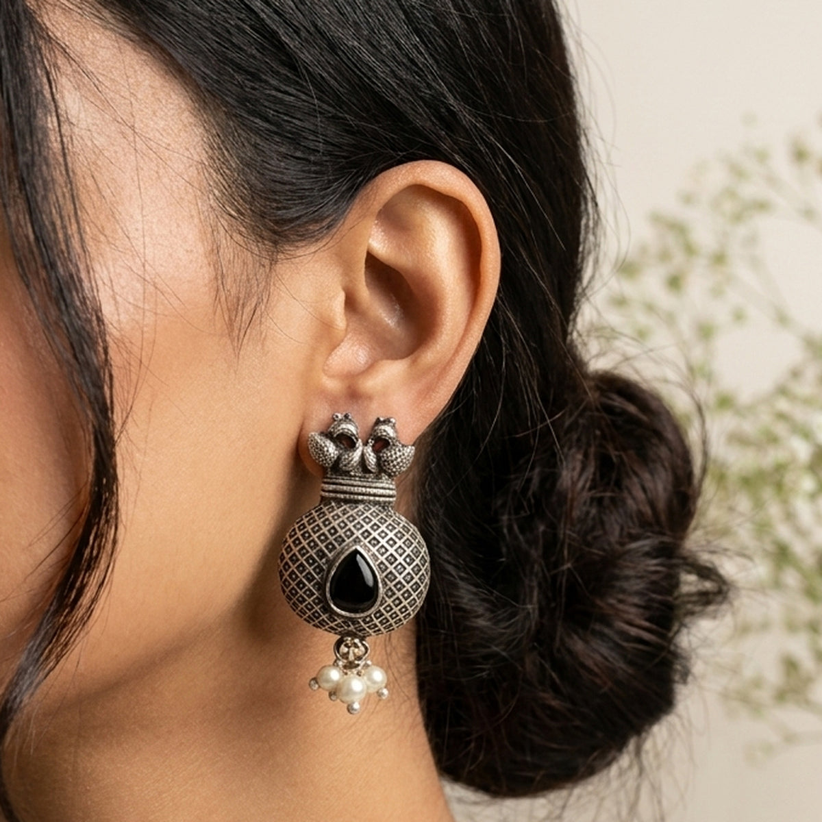 Matki Pot Jhumka — Onyx Black worn on the ear, handmade by Dream Karigiri
