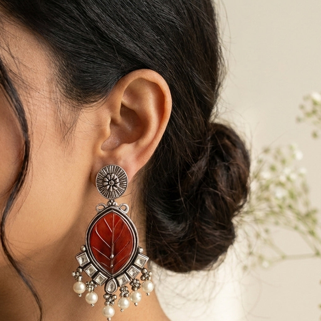 Carved Carnelian Kundan Drop Earrings worn on the ear, handmade by Dream Karigiri