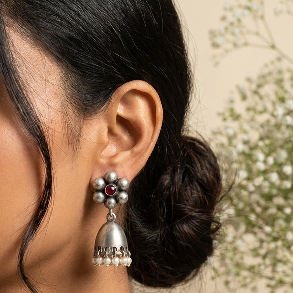 Silver Kundan Flower Jhumka worn on the ear, handmade by Dream Karigiri
