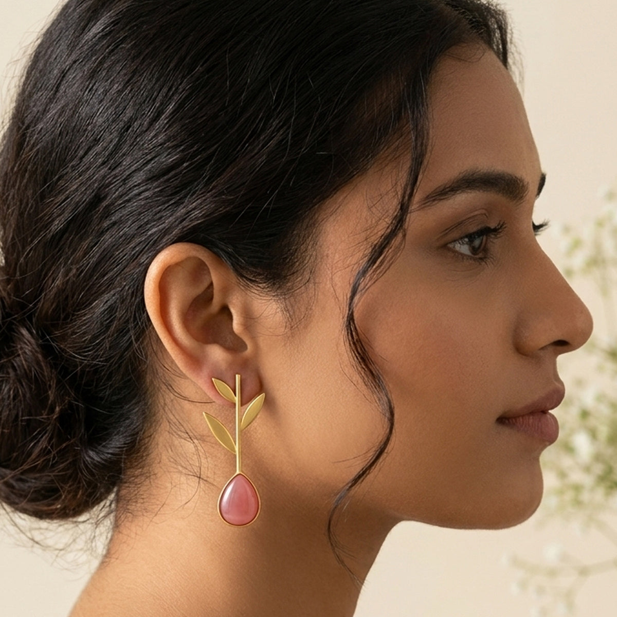 Golden Leaf & Rose Drop Earrings worn on the ear, handmade by Dream Karigiri