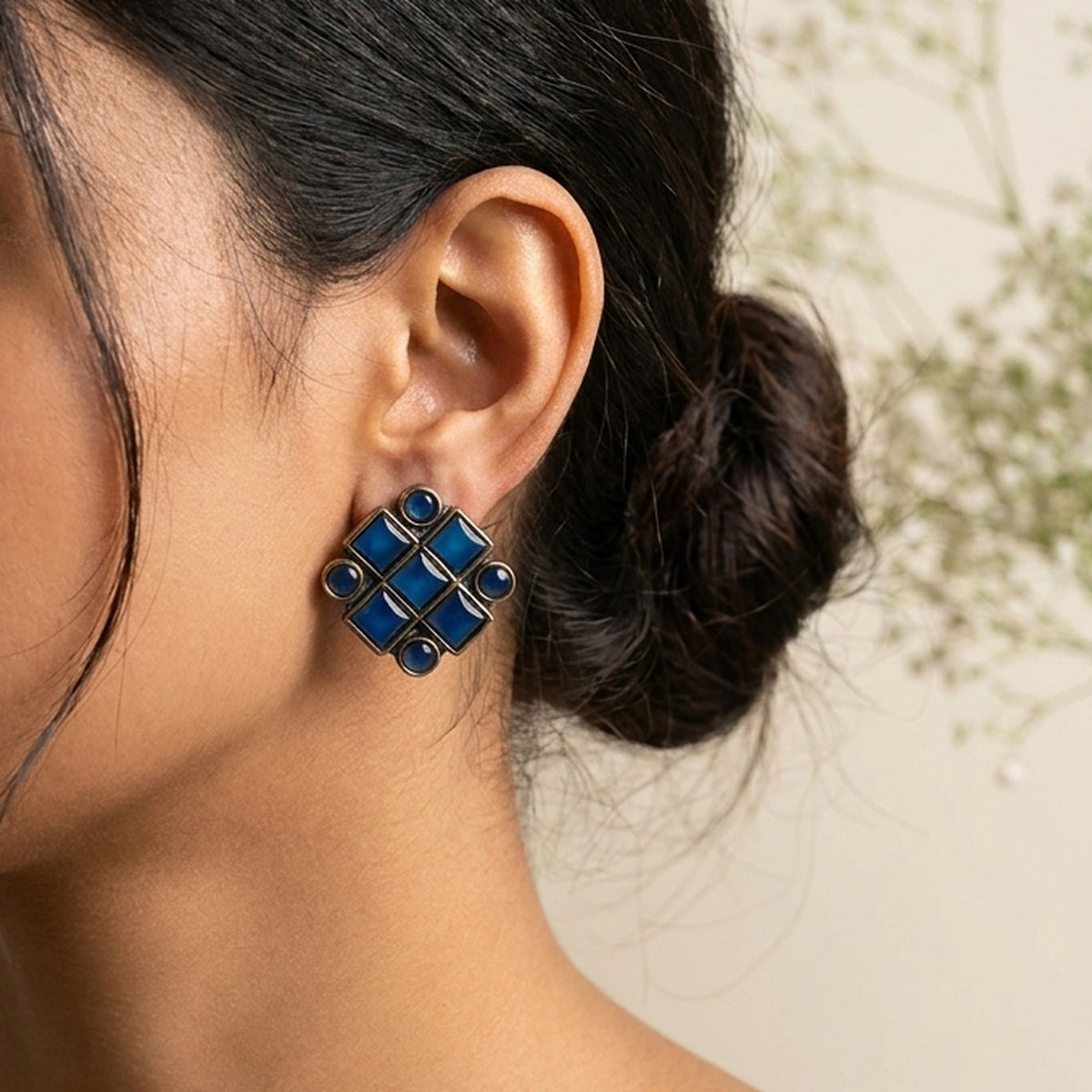 Sapphire Blue Kundan Cluster Studs worn on the ear, handmade by Dream Karigiri