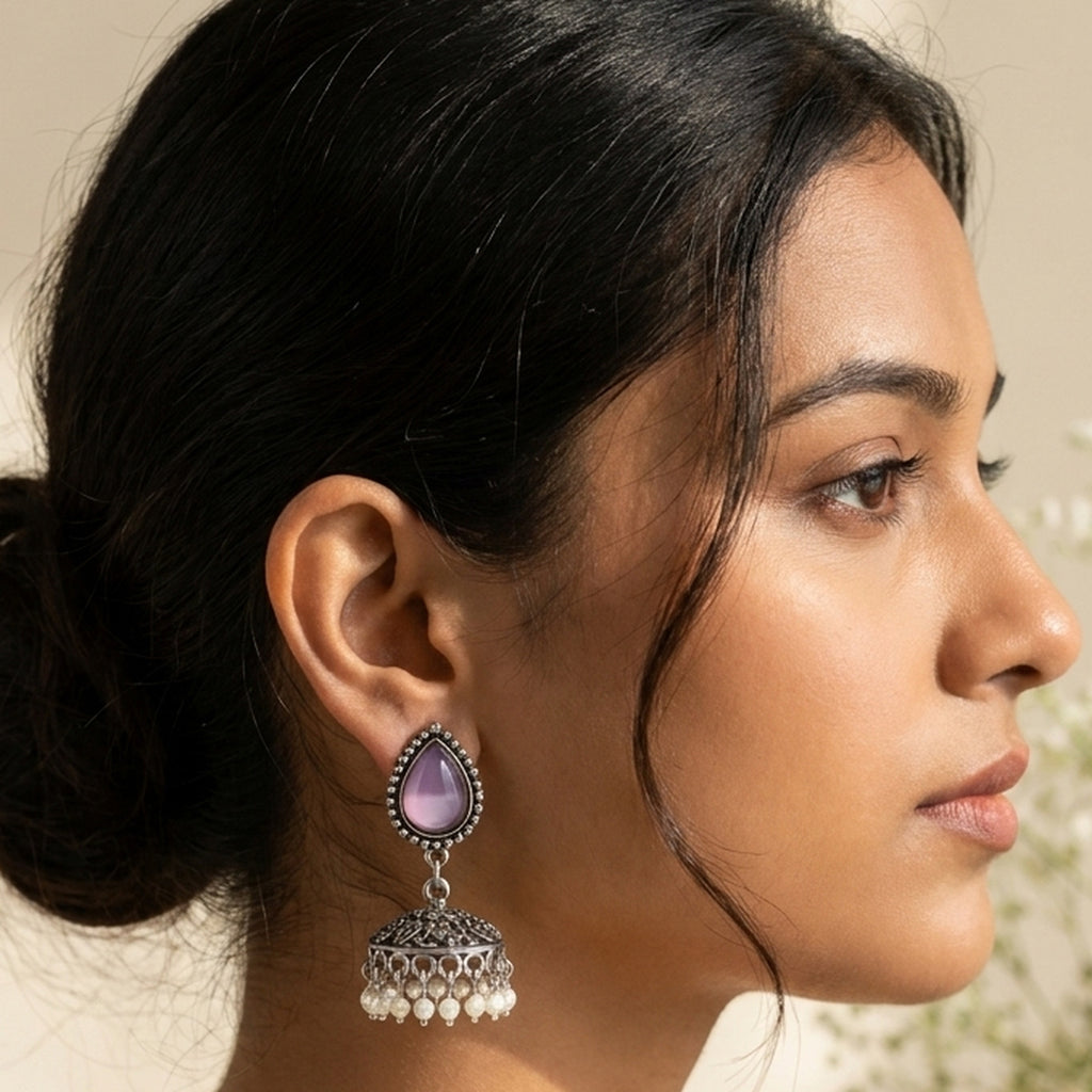 Lilac Bloom Teardrop Jhumkas worn on the ear, handmade by Dream Karigiri