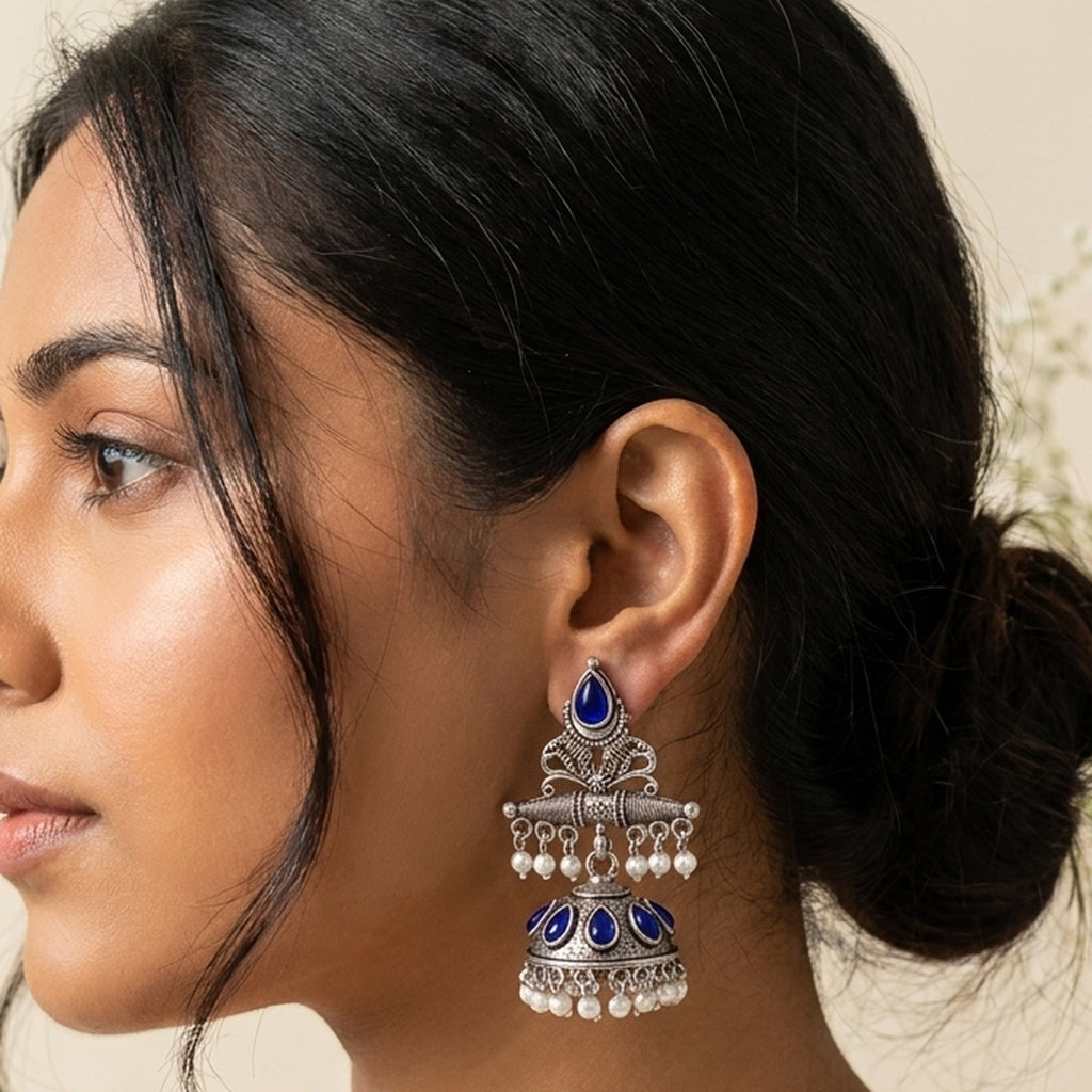Oxidized Silver Jhumka - Blue worn on the ear, handmade by Dream Karigiri